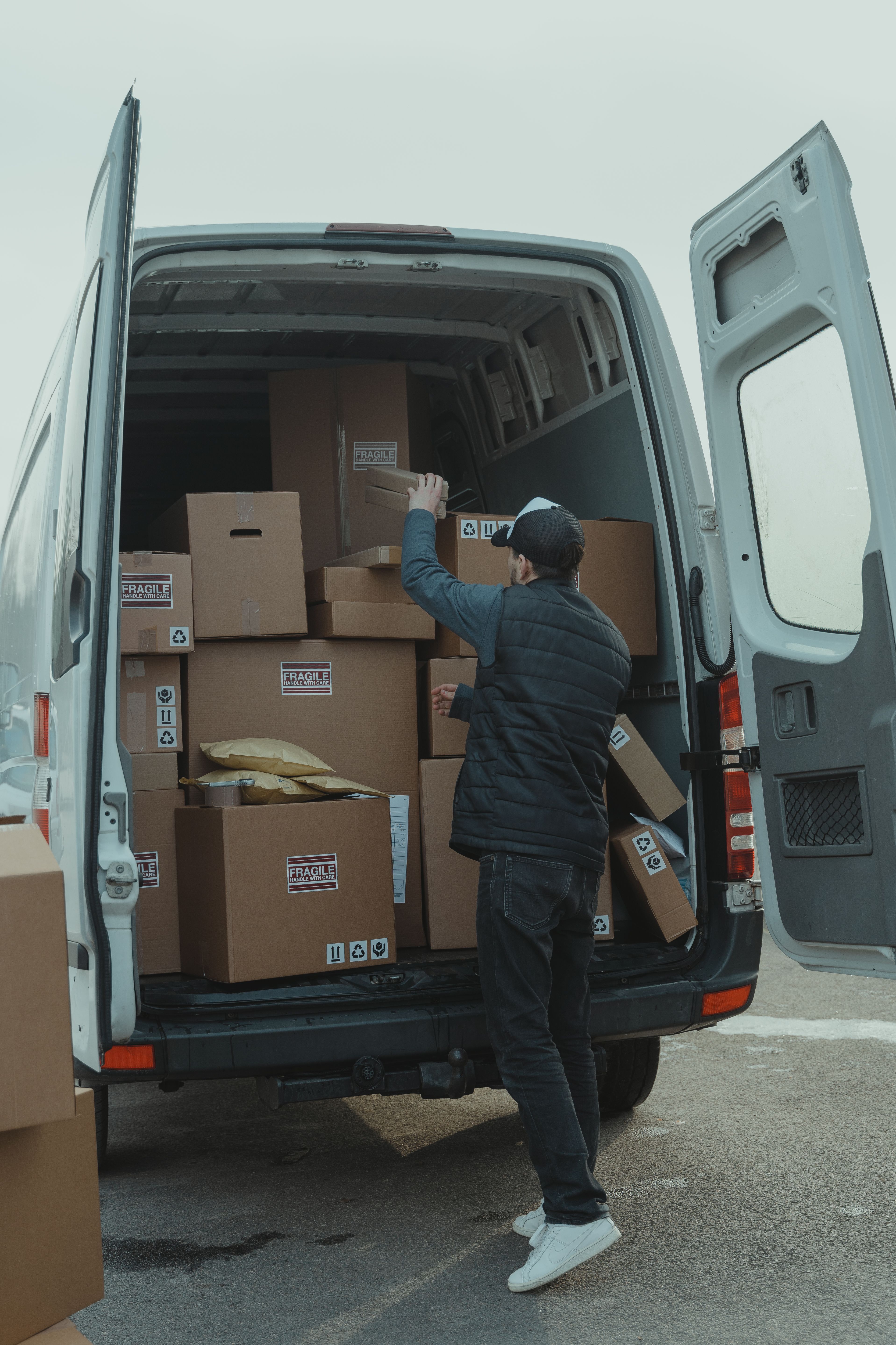 Illustrative photograph of parcels being loaded into a delivery vehicle